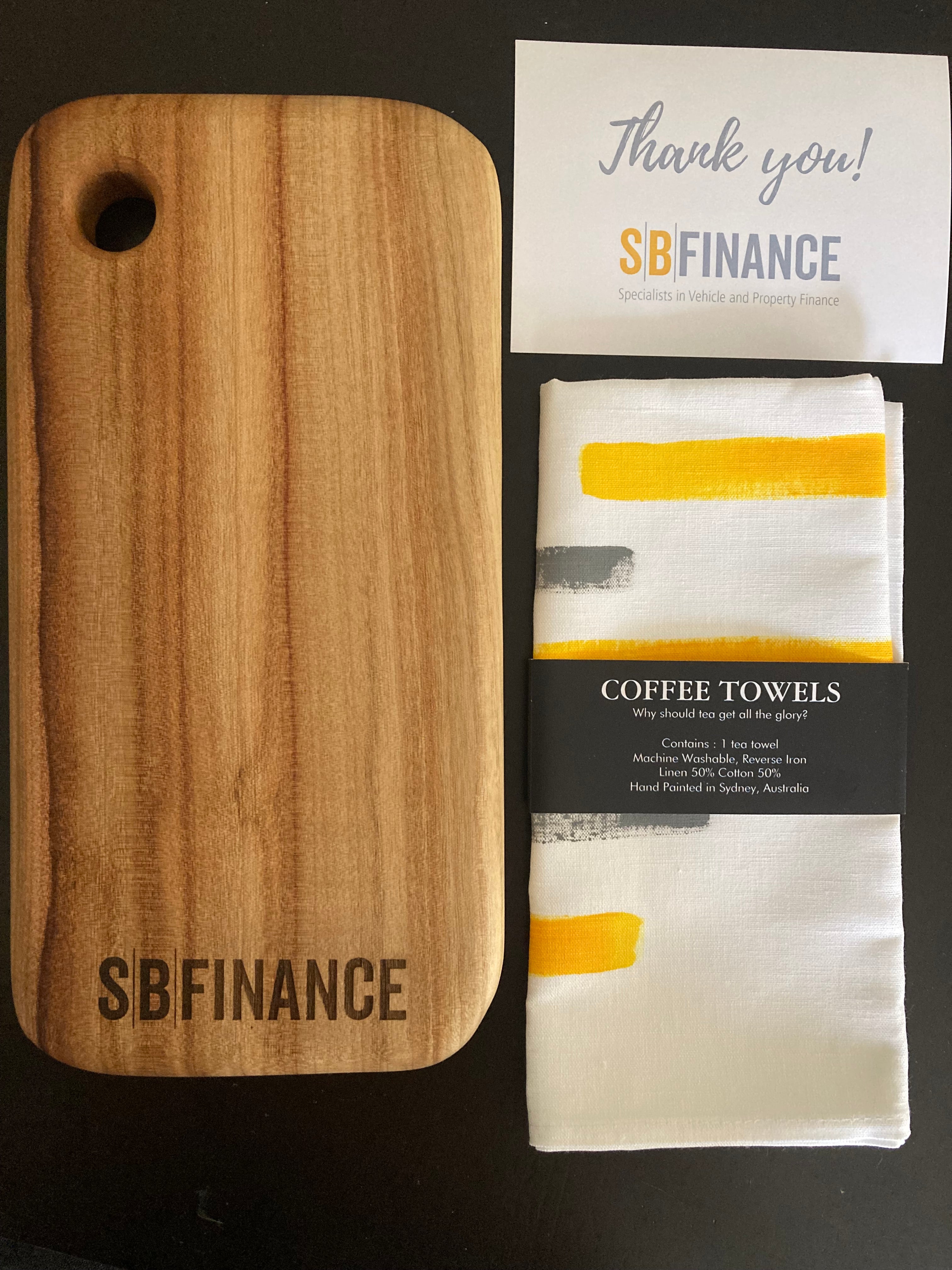 Branded Cheese board, with branded gift card and painted coffee towel to highlight brand colours