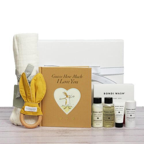 New baby gift box with bamboo muslin wrap, timber teething ring, baby bath wash products and "Guess how much I love you" collectors book