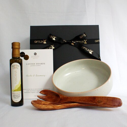 Stoneware salad bowl with timber salad servers, lemon infused olive oil and lavosh shards