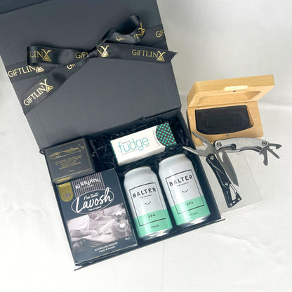 Gift set with Balter XPA bottles, a knife, and other items in a black gift box.