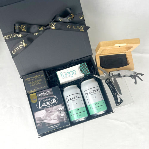 Gift set with Balter XPA bottles, a knife, and other items in a black gift box.