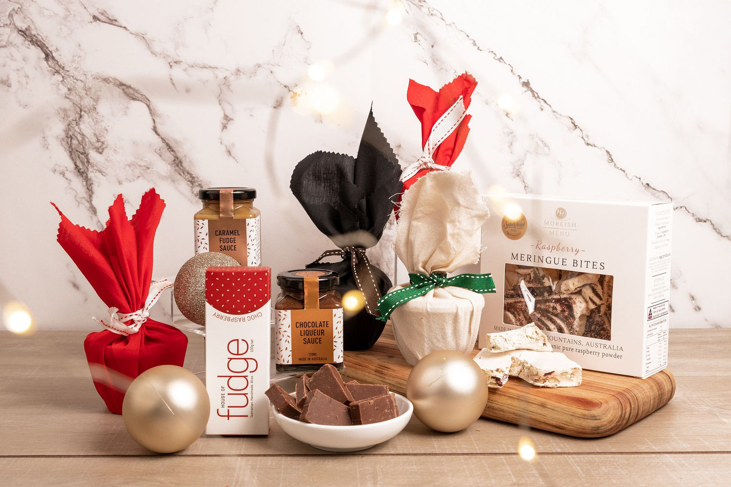 a selection of sweet Christmas treats on a timber serving board