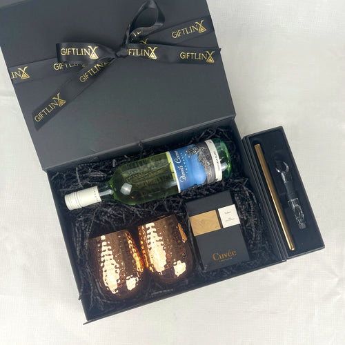 Wine gift set with bottle, glasses, and accessories in a black box labeled 'GIFTLINX'.