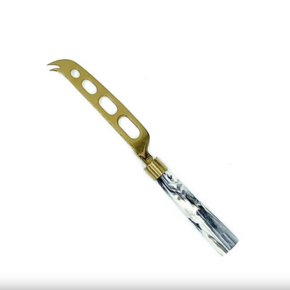 brass cheese knife with marble handle on white background