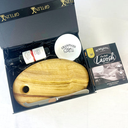 Gift set with wooden tool, bottle, and box on a white background