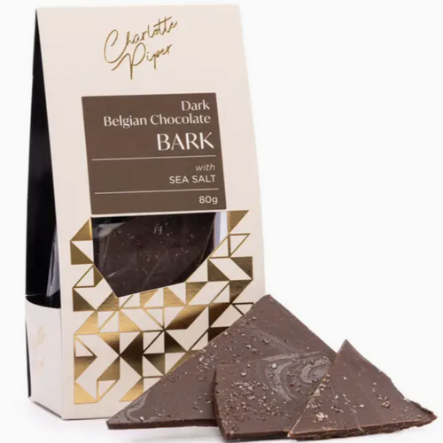 White and gold box of dark chocolate shards showing the shards in front of the box