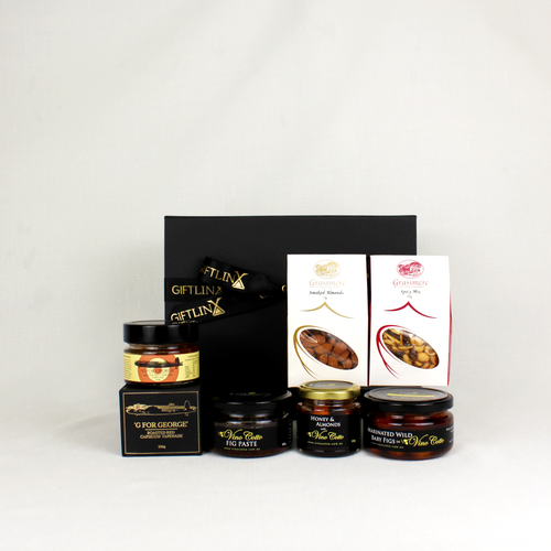 black git box standing alongside capsicum tapenade, smoked almonds, marinated figs and honey coated almonds