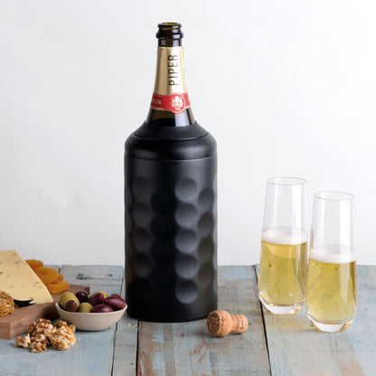 black stainless steel wine cooler with a bottle of champagne and a cheese platter