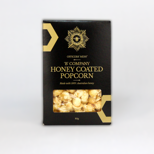 honey coated popcorn in a black and gold box