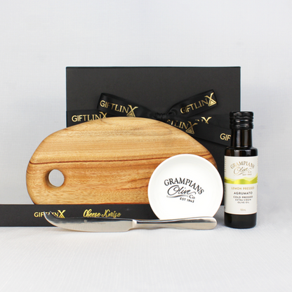 GIft hamper with small handmade cheese board, single stainless steel cheese knife, infused olive oil with dipping bowl