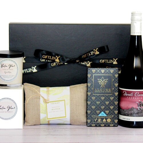 spend a great Friday Night In with this care hamper including wine, luxury soy candle jar, soothing heatpack and premium Australian made chocolate