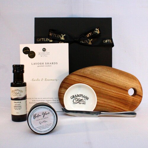 A perfect gift hamper to say thank you! This gift hamper includes a handmade timber cheese board, infused olive oil and dipping bowl, lavosh shards, cheese knife and a luxury soy candle tin