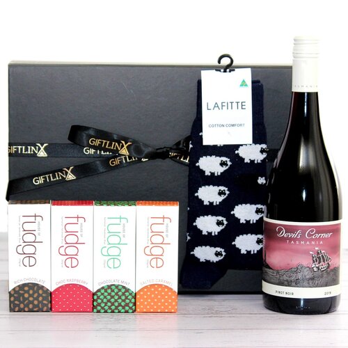 Relax with this gift hamper - wine, 4 bars of Australian made fudge and socks