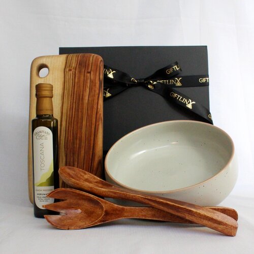 Stoneware salad bowl with timber salad servers, handmade timber board and infused olive oil