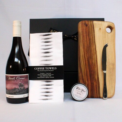 Gift hamper with handmade timber cheese board, single stainless steel cheese knife, linen blend kitchen towel, wine and luxury soy candle