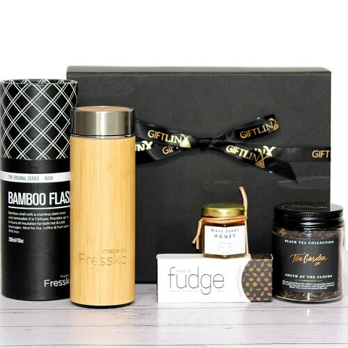 Tea lovers gift box with a reusable bamboo tea flask, loose leaf tea, honey and fudge